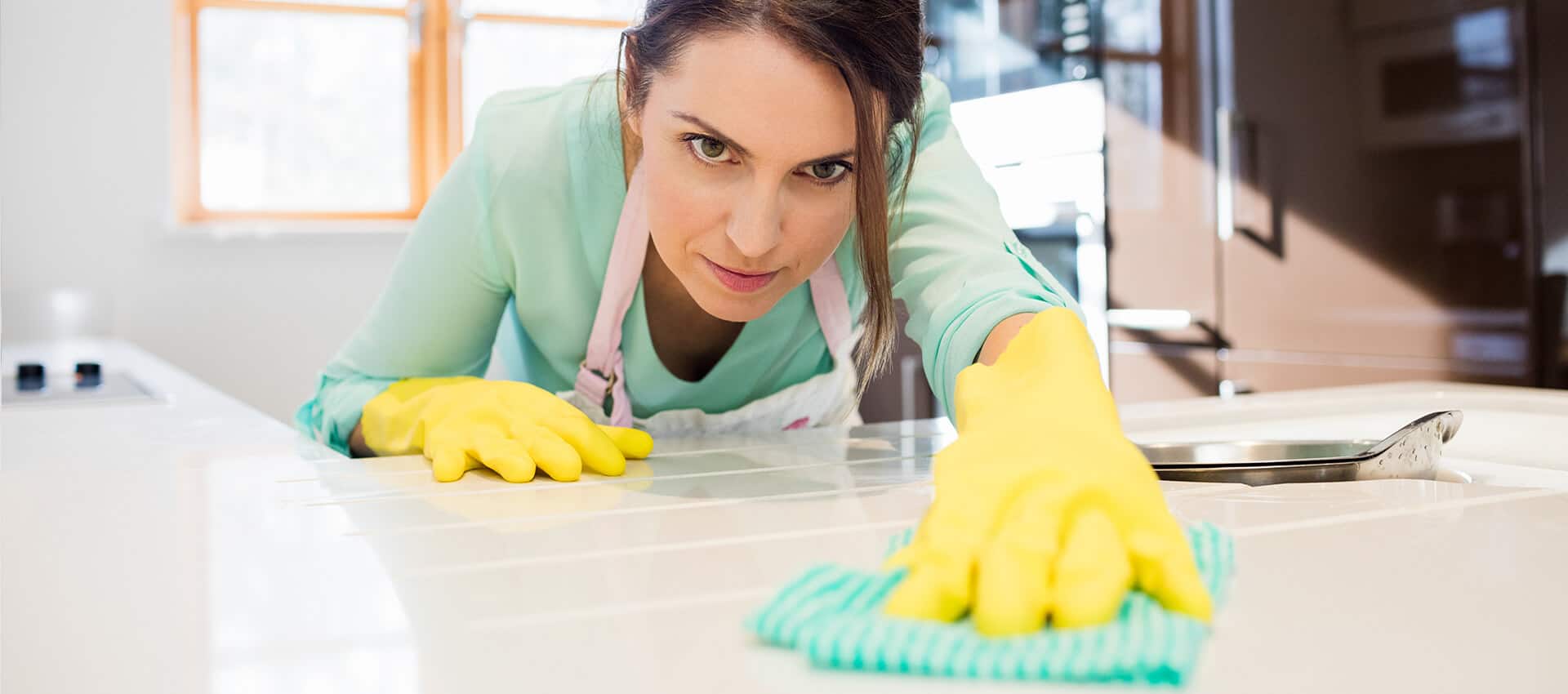 women-cleaning-table